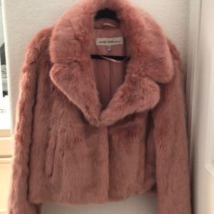 Pink faux fur coat with pockets. Sits at waist. Very comfy, its lined.